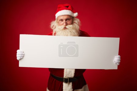 Santa with blank paper