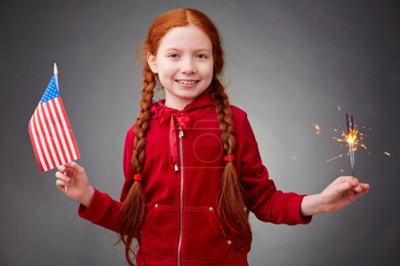 Girl with benghal light and American flag