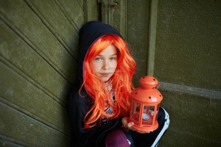 Child with Halloween lantern