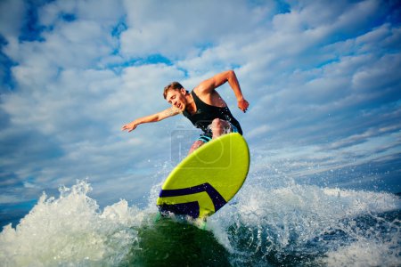Male surfer riding on board