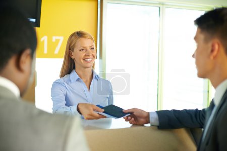 Businessman at registration in airport