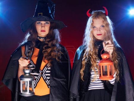 Halloween girls with lanterns