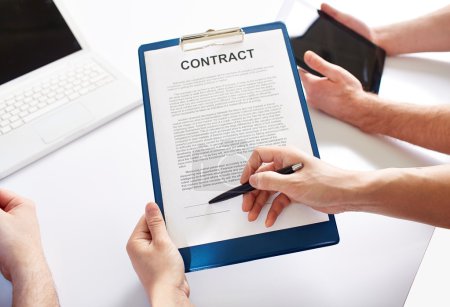 Hands holding  business contract
