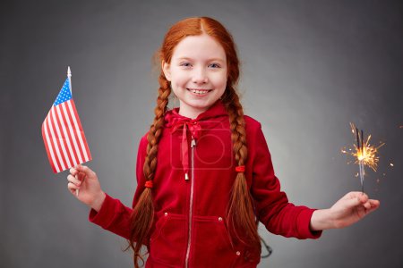 Girl with bengal light and American flag
