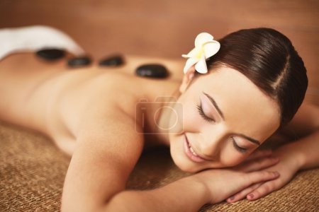 Young female enjoying spa procedure