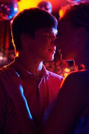 Amorous couple in night club