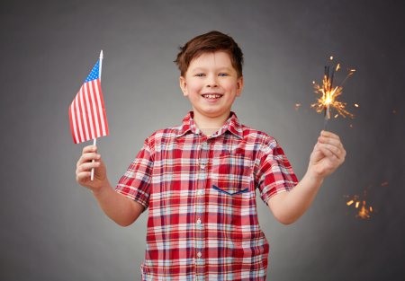 Boy with benghal light and American flag