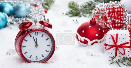 Vintage alarm clock in the snow