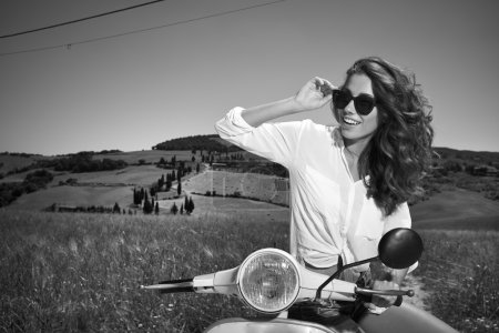 Woman on scooter in Tuscany