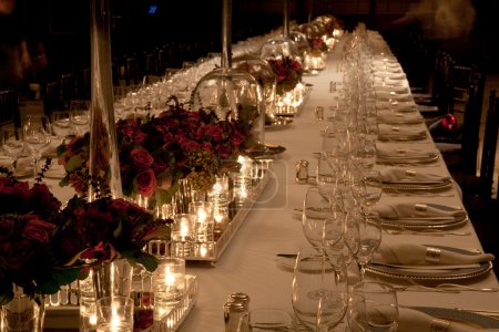 Elegant candlelight  dinner table setting at reception