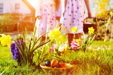 Children on Easter egg hunt with eggs
