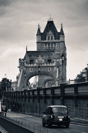 Tower Bridge closeup with vintage taxi