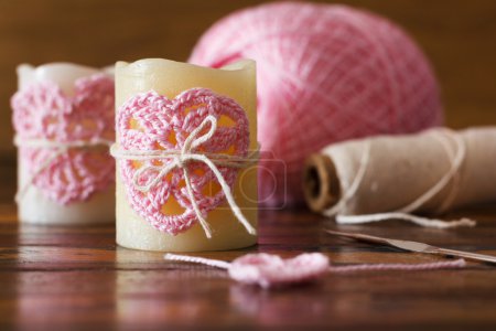 Two candle with  pink crochet handmade heart for Saint Valentine