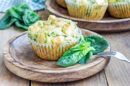 Freshly baked snack muffins with spinach and feta cheese