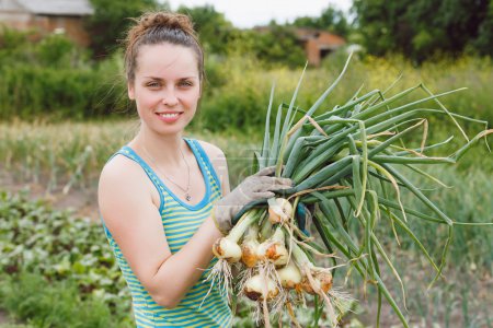 Woman with bunches of onion