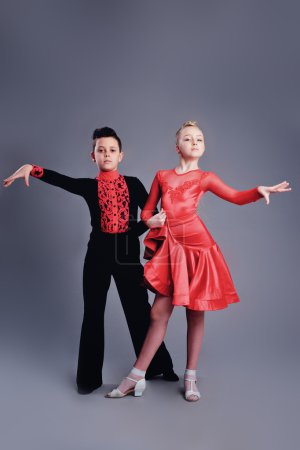 Two beautiful children dancing ballroom dance sport