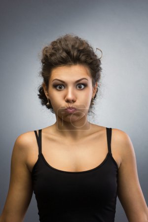 woman with  puffing out one's cheeks