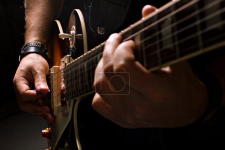 men playing on guitar