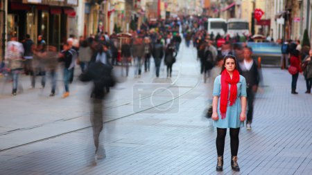 Woman posing on busy street