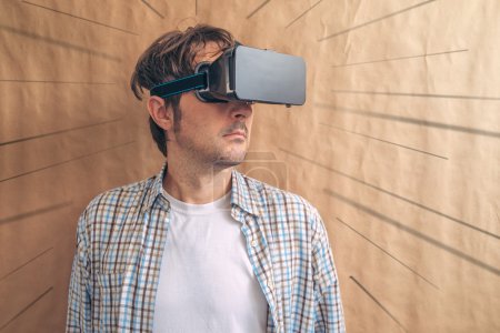Man with VR goggles exploring virtual reality econtent