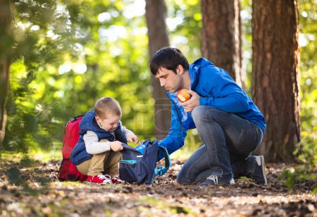 Father with son eating apple