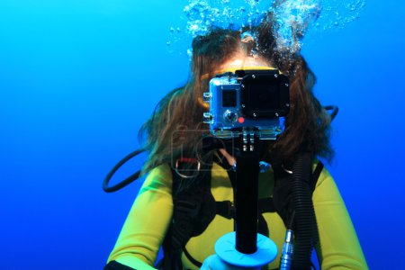 Scuba diver with action camera