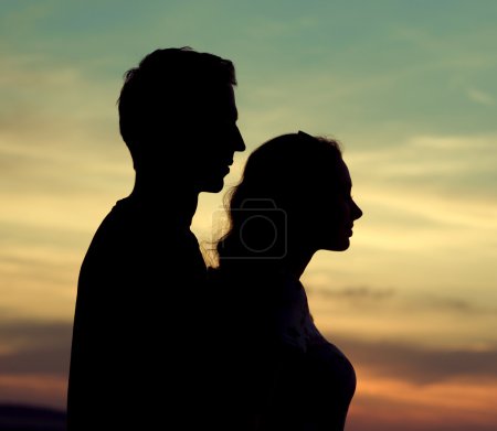 Silhouettes of the young couple