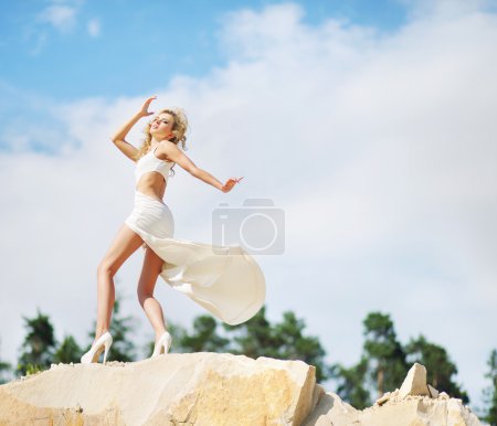 Portrait of the cutie dancing on the rocks