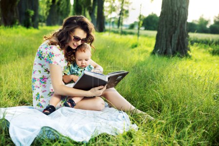 Brunette mother reading a fairy tale for her child