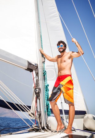 Happy man on sailboat