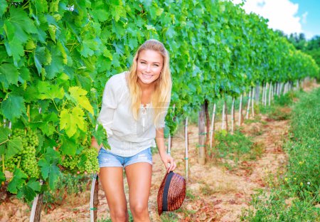 Happy woman on vineyard
