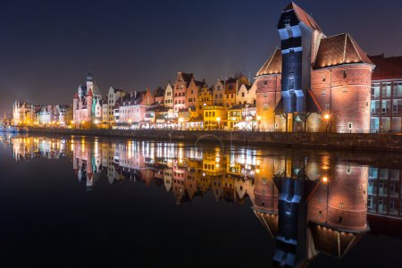Old town of Gdansk with ancient crane at night
