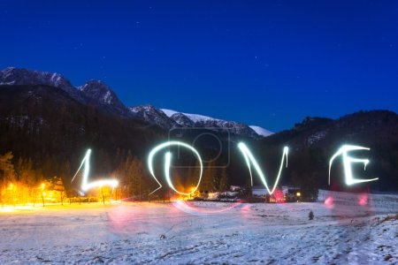 Love sign under Tatra mountains at night