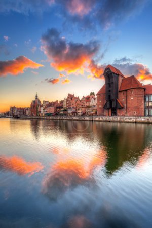 Old town of Gdansk with ancient crane at sunset