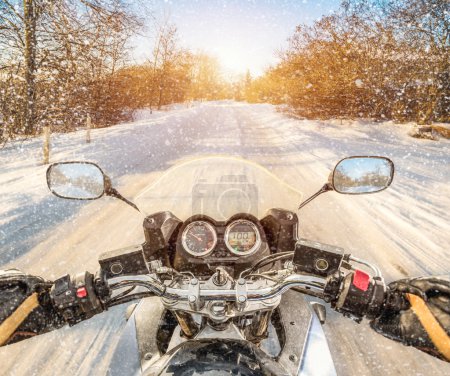 Biker First-person view. Winter slippery road