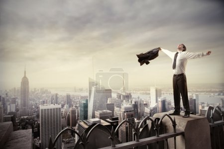 businessman standing on the rooftop
