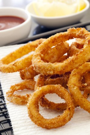 Fried Onion Rings with Ketchup and Lemon