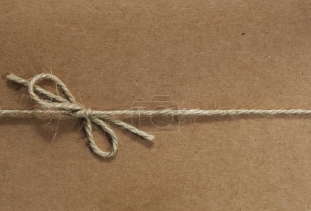 String tied on Recycled Paper