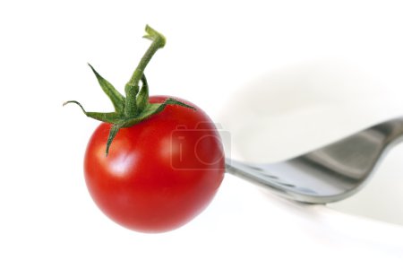 Tomato and Fork on Bowl
