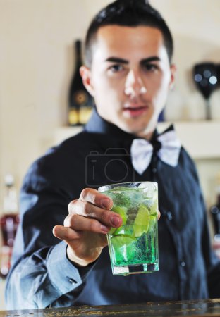 Pro barman prepare coctail drink on party