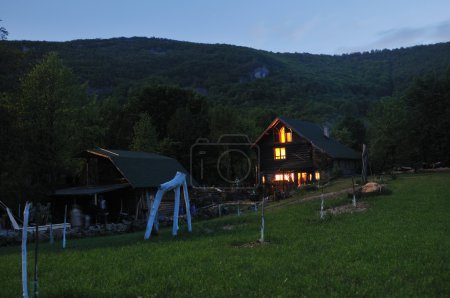 Wooden countryside house in night