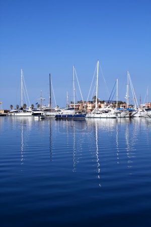 Boats in blue marina Mediterranean sea Denia