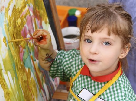 Artist school little girl painting watercolors portrait