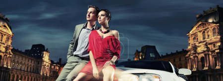 Colorful image of beautiful couple sitting in a limousine