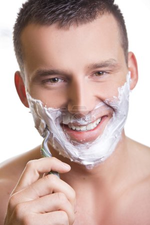 Shaving man with grin smile
