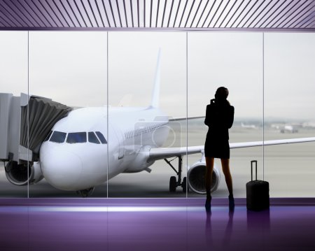 Silhouette of woman at the airport