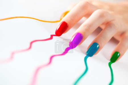 Young woman hand with multicoloured nail