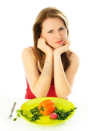 Displeased woman keeping a diet