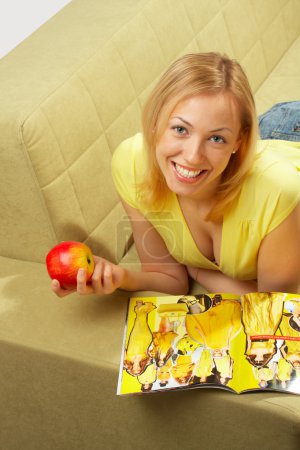 The attractive girl & red apple