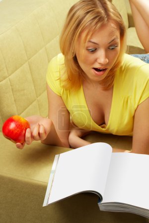 The attractive girl & red apple